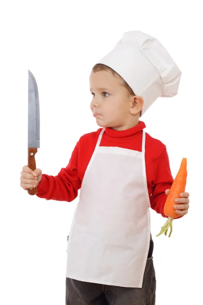 Pequeño jefe de cocina con cuchillo de cocina y zanahoria — Foto de Stock