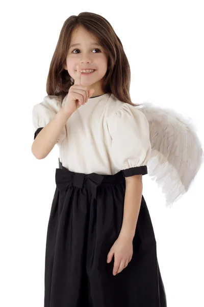 Little girl with angel wings signing silence — Stockfoto