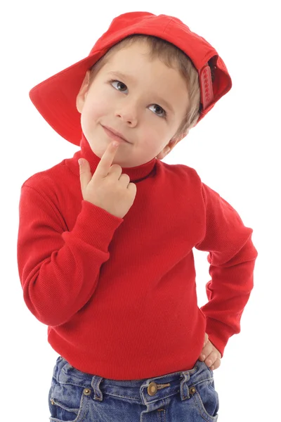 赤い帽子を考える上で小さな男の子の笑みを浮かべて 白で隔離されます — ストック写真