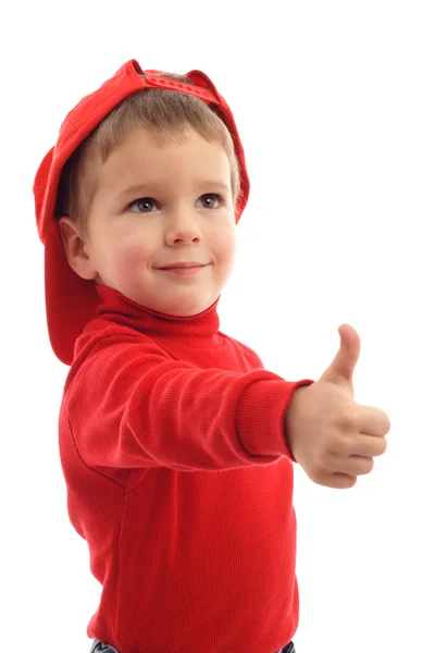 Μικρό αγόρι στο κόκκινο καπέλο με τον αντίχειρα επάνω σημάδι — Φωτογραφία Αρχείου
