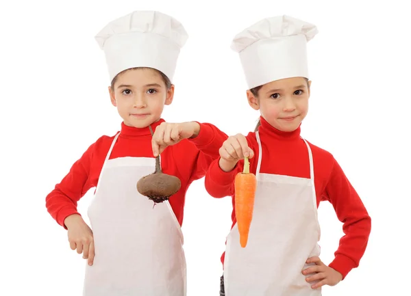 Dois Pequenos Cozinheiros Chefes Que Mantêm Uns Verduras Isolados Branco — Fotografia de Stock