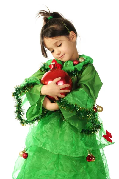Χαμογελαστά κοριτσάκι στο κοστούμι πράσινο χριστουγεννιάτικο δέντρο — Φωτογραφία Αρχείου