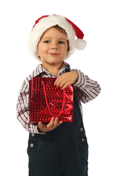 クリスマスのギフト袋を持った少年の笑顔 — ストック写真