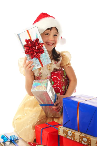 Niña sonriente con cajas de regalo de Navidad —  Fotos de Stock
