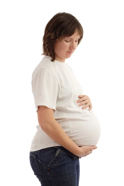 Mulher grávida abraça sua barriga — Fotografia de Stock