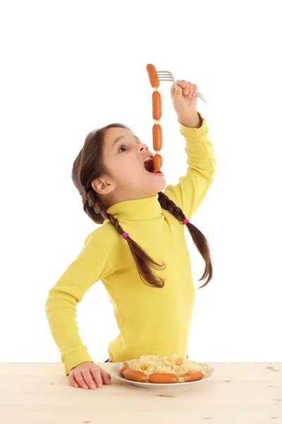 Little girl eating the chain of sausages — Stock Photo, Image