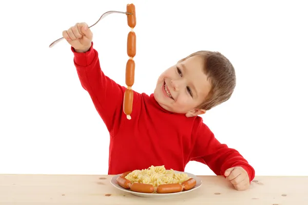 Ragazzo sorridente con catena di salsicce — Foto Stock