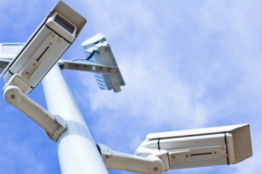 Surveillance cameras from low angle clipart