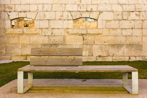 Wooden bench in a rock castle — Stock Photo, Image