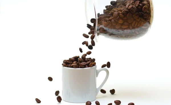 stock image Filling the cup with coffee beans