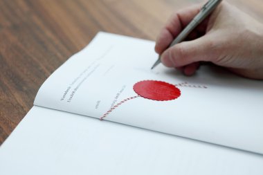 A public notary signing a contract clipart