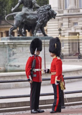 Queens guards near Buckingham Palace in London clipart