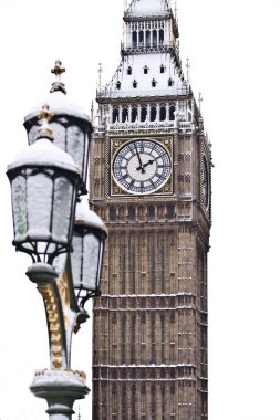 Snow and Big Ben before Christmas in London clipart