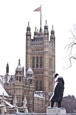 Snow and fog near Westminster Palace before Christmas in London clipart