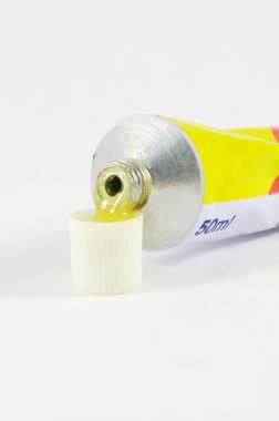 Glue tube close up over the surface clipart