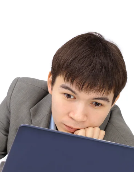 Smiling young man working on laptop at home copy space — Stock Photo, Image