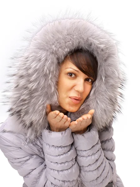 The winter girl sends an air kiss — Stock Photo, Image