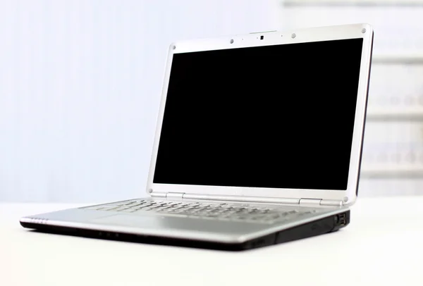 Silvery laptop at modern office — Stock Photo, Image