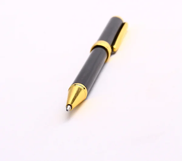 Золотая ручка на белом фоне Стоковое Изображение