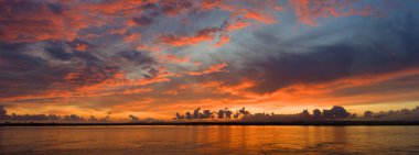 Panoramic sunset in the Guadiana river clipart