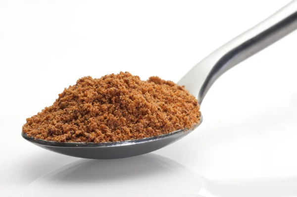 Nutmeg in a spoon — Stock Photo, Image