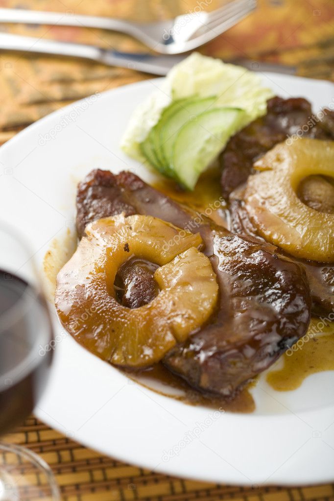 Roast meat with pineapple slices