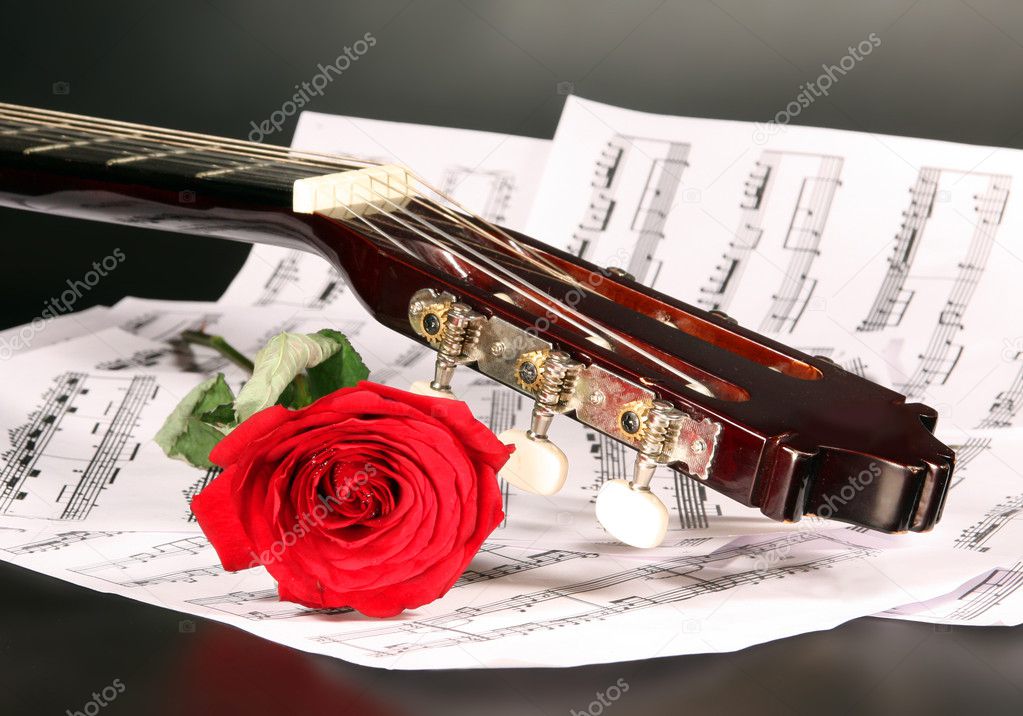 Notes, guitar and rose
