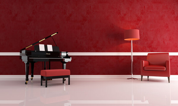 Grand piano in a red living room with leather armchair and modern floor lamp