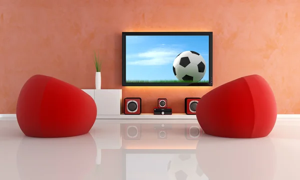À espera de jogo de futebol em uma sala de estar moderna — Fotografia de Stock