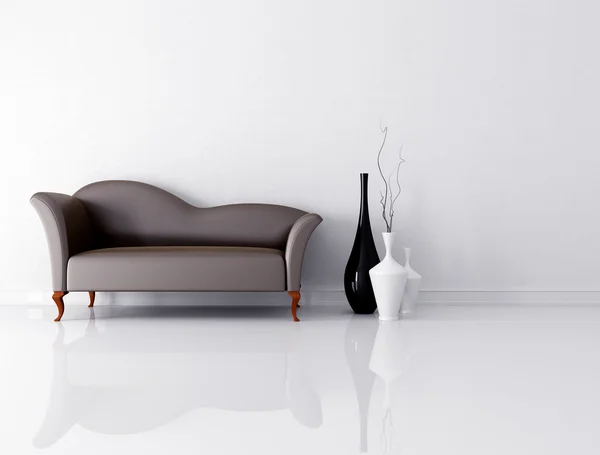 Braune Couch in einem weißen Raum lizenzfreie Stockbilder