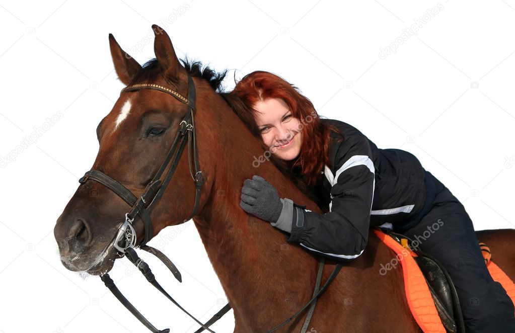 Happy smiling redhaired girl on a horseback isolated