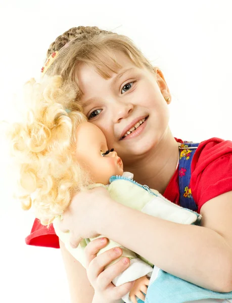 A girl with a doll — Stock Photo, Image