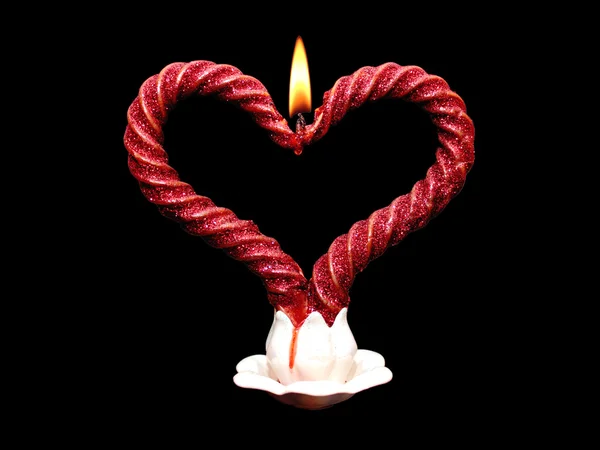Zwei rote brennende Kerzen spiralförmig — Stockfoto