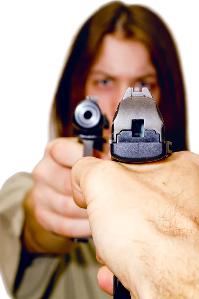 stock image A young man aiming a gun