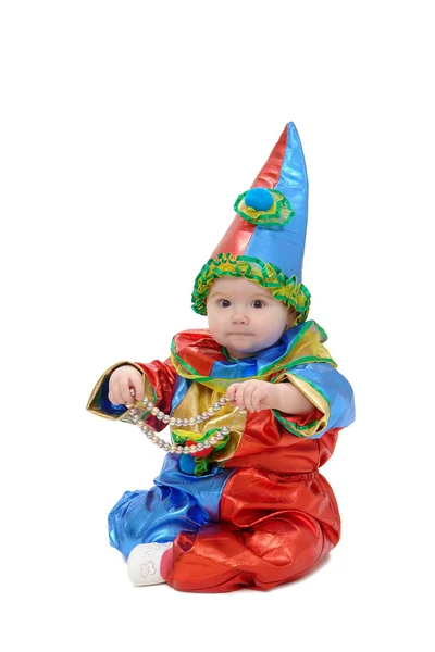 Een klein kind gekleed in een clown-kostuum — Stockfoto