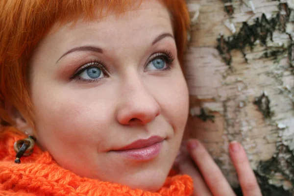 Stock image Young red-haired woman in red scarf