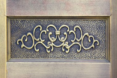 Enchased in metal decorative pattern on the wall clipart