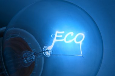 Close up on illuminated blue light bulb filament spelling the word 