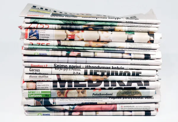 Stack of newspapers isolated on white — Stock Photo, Image