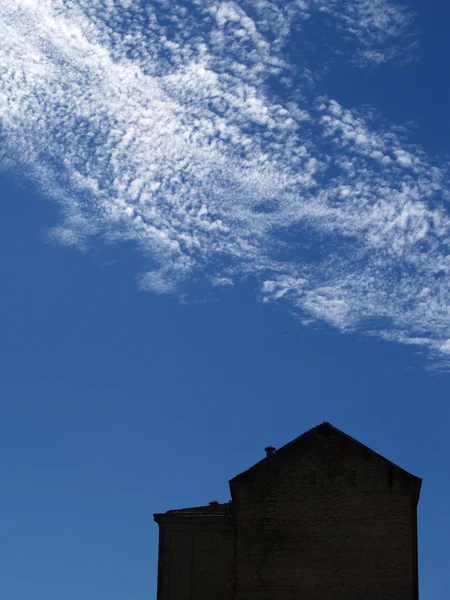 stock image House silhouette with sky in background