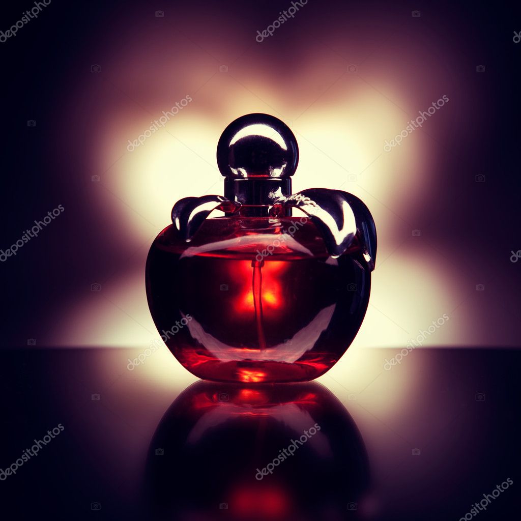 perfume in purple apple shaped bottle