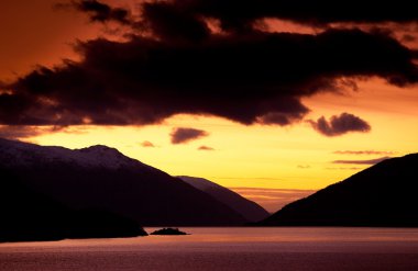 Sunset on fjord. Norway. clipart