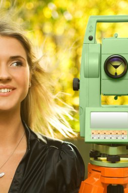 Young Girl and The Geodetic Total Station clipart