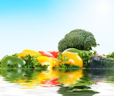 Improbable island from fresh vegetables clipart