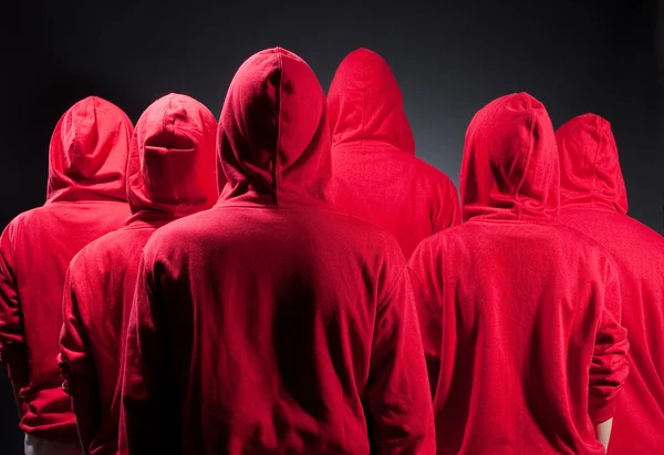 Backs of in red clothes — Stock Photo, Image
