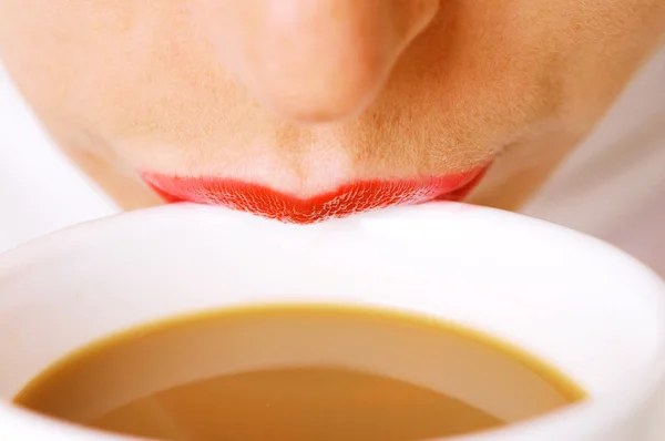 Lips on cup of coffee with milk — Stock Photo, Image