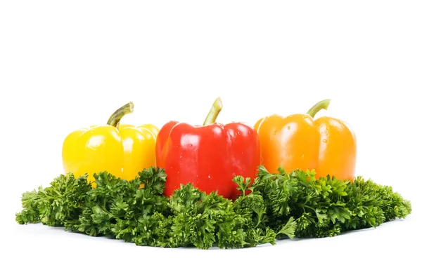 Three peppers on green island — Stock Photo, Image