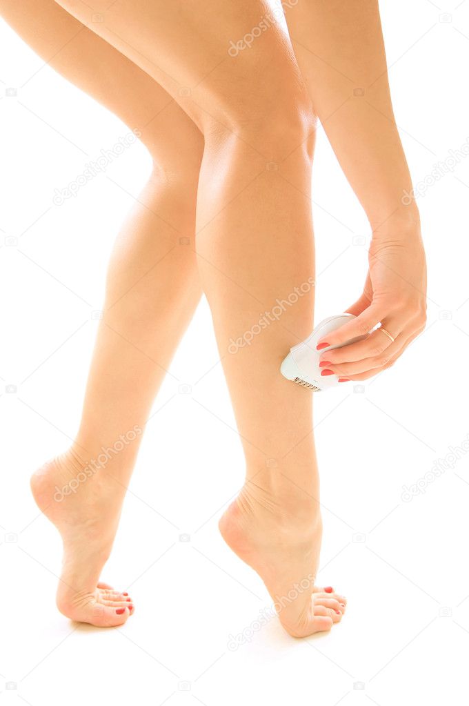 Woman epilating nice legs