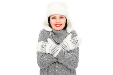 Smiley woman in hat and mitten