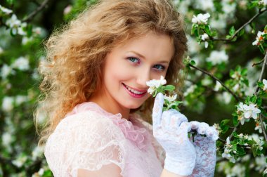 Smiley model posing in white flowers clipart